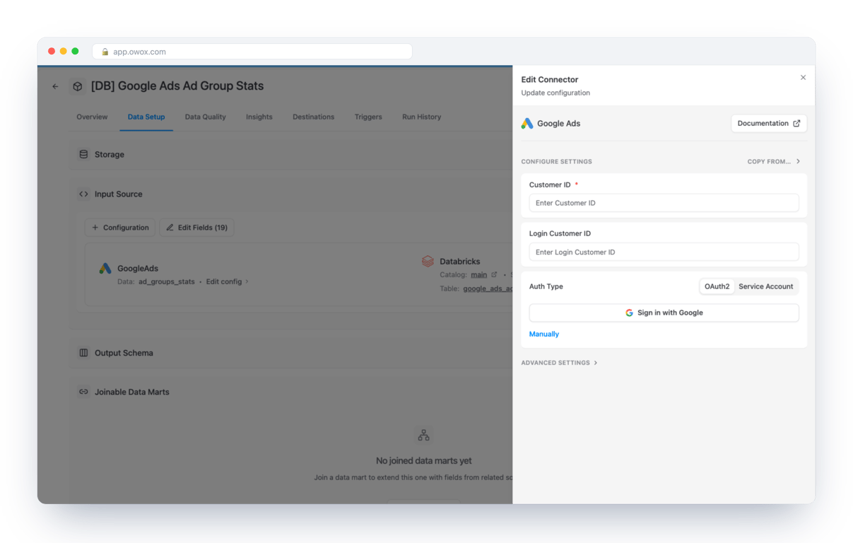 Edit Connector form for Google Ads in OWOX Data Marts on a Databricks Data Mart, with Customer ID and Login Customer ID fields, an auth type switch between OAuth2 and Service Account, and a Sign in with Google button – the ad account and the manager account are entered separately