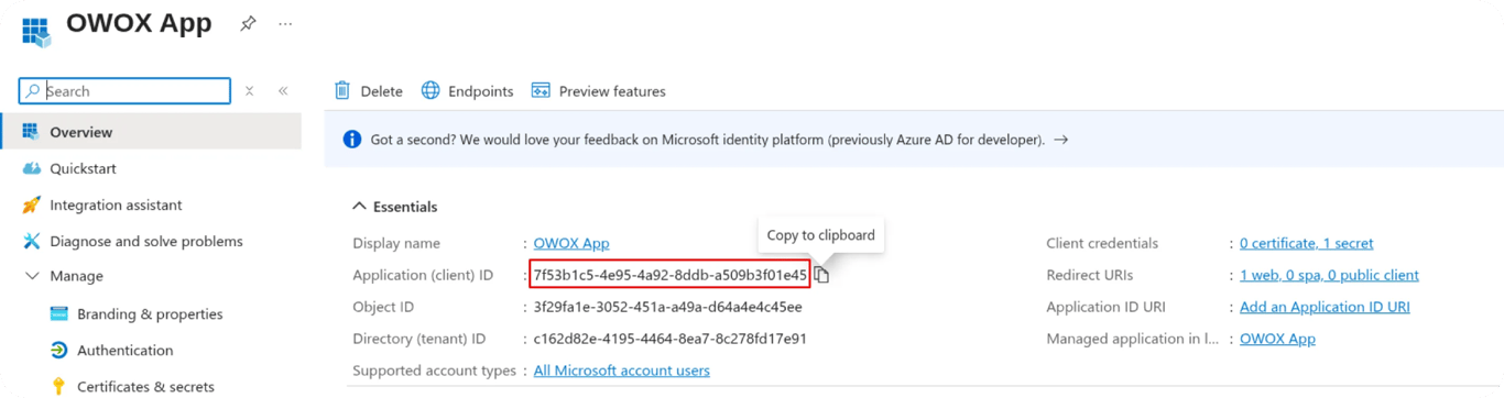 Azure portal showing the OWOX App overview page, highlighting the Application (client) ID field with its GUID value boxed in red and a “Copy to clipboard” tooltip visible. i-shadow